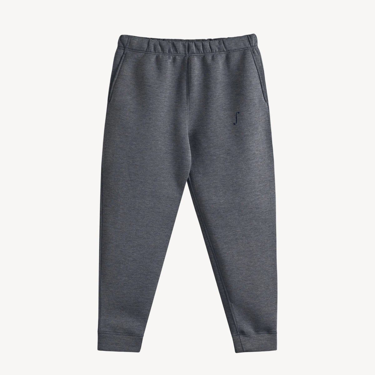 Collis Felix（コリス フィリックス）のチャコールグレーのダンボールニットストレッチパンツ。ウエストゴム、サイドポケット、左もものfロゴ、裾リブが見える正面の商品画像。